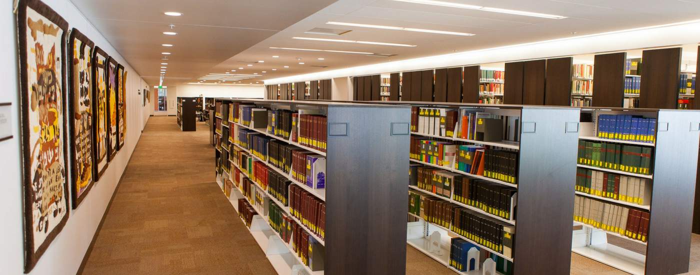 Photograph of book stacks in the Ostrow library